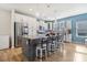 Bright kitchen features an island with bar seating, stainless steel appliances, and ample storage at 50143 Robins Nest Ln, Lancaster, SC 29720