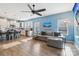 Open concept: living room, kitchen, and breakfast bar with hardwood floors and plenty of natural light at 50143 Robins Nest Ln, Lancaster, SC 29720