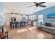 Open floorplan showcasing a kitchen with breakfast bar and living room with hardwood floors at 50143 Robins Nest Ln, Lancaster, SC 29720