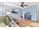 Bright living room with hardwood floors, ceiling fan, and modern decor at 50143 Robins Nest Ln, Lancaster, SC 29720