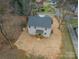 Aerial view of a two-story home featuring a wooden deck and spacious backyard at 5125 Isaac Dr, Charlotte, NC 28216