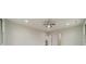 A bright, spacious bedroom with a ceiling fan and an open doorway to the hall at 5125 Isaac Dr, Charlotte, NC 28216