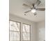 Bright bedroom featuring a ceiling fan and two windows allowing natural light at 5125 Isaac Dr, Charlotte, NC 28216