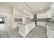 Spacious kitchen with white cabinets, a central island with granite countertops and stainless steel appliances at 5125 Isaac Dr, Charlotte, NC 28216
