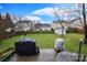 Spacious backyard with a green lawn, storage shed and outdoor grills at 514 Galesburg Dr, Monroe, NC 28110