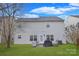 Backyard with a green lawn, patio area and outdoor grill at 514 Galesburg Dr, Monroe, NC 28110