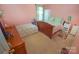 Cozy bedroom with two beds, a window, and ample natural light at 514 Galesburg Dr, Monroe, NC 28110