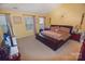 Bedroom with a leather base bed frame, large windows, and yellow walls at 514 Galesburg Dr, Monroe, NC 28110