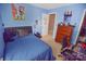 Comfortable bedroom featuring blue walls, carpet, and a well-lit interior at 514 Galesburg Dr, Monroe, NC 28110