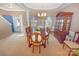 Formal dining room with large wooden table, hutch and natural lighting at 514 Galesburg Dr, Monroe, NC 28110