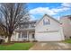 Charming two-story home with a well-manicured lawn and a covered front porch, showcasing curb appeal at 514 Galesburg Dr, Monroe, NC 28110