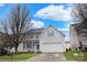 Inviting two-story home with a two-car garage, featuring blue shutters and a neatly landscaped front yard at 514 Galesburg Dr, Monroe, NC 28110