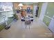 Bright kitchen with a dining area, featuring wooden cabinets and ample counter space for meal preparation at 514 Galesburg Dr, Monroe, NC 28110