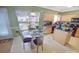 Well-lit kitchen includes wooden cabinets, black appliances and cozy breakfast nook at 514 Galesburg Dr, Monroe, NC 28110