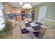 Inviting kitchen features wooden cabinets, black appliances and cozy breakfast nook with chairs at 514 Galesburg Dr, Monroe, NC 28110