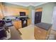 Bright kitchen with wood cabinets, modern appliances, and a convenient center island at 514 Galesburg Dr, Monroe, NC 28110