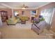 Spacious living room with a fireplace, ceiling fan, and ample seating, ideal for entertaining and Gathering time at 514 Galesburg Dr, Monroe, NC 28110