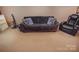 Comfortable living room featuring a plush sofa and recliner at 514 Galesburg Dr, Monroe, NC 28110