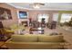 Cozy living room with a fireplace, comfortable seating, and a ceiling fan, perfect for relaxing at 514 Galesburg Dr, Monroe, NC 28110
