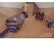 Living room with a plush sofa, recliner, dining table, and an open layout at 514 Galesburg Dr, Monroe, NC 28110