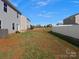 Spacious backyard featuring green grass and a white fence at 709 Daniel Ln, Richburg, SC 29729