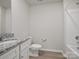 Bathroom with a granite countertop, tiled floors, and combination shower and tub at 709 Daniel Ln, Richburg, SC 29729