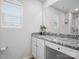 Bright bathroom featuring a granite countertop, sleek vanity, and framed mirror at 709 Daniel Ln, Richburg, SC 29729