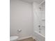 Clean bathroom with a shower-tub combo, white tiling, and chrome fixtures at 709 Daniel Ln, Richburg, SC 29729