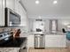 Stylish kitchen with stainless steel appliances, granite counters, white cabinets, and an open layout perfect for entertaining guests at 709 Daniel Ln, Richburg, SC 29729
