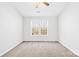Cozy bedroom with a ceiling fan and double window, creating a bright and airy space at 8263 Carob Tree Ln, Charlotte, NC 28215