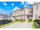 Charming exterior of a two-story home with beautiful landscaping and a private driveway at 8263 Carob Tree Ln, Charlotte, NC 28215