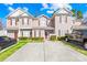 Charming townhome featuring a well-maintained lawn and private driveway at 8263 Carob Tree Ln, Charlotte, NC 28215