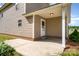 Back patio with room for chairs and a table at 8309 Knapp Ct, Locust, NC 28097