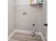 Compact laundry room with vinyl flooring and available hookups at 8309 Knapp Ct, Locust, NC 28097