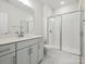 Modern bathroom featuring white marble floors, glass shower, and chrome hardware at 10113 Mamillion Dr, Huntersville, NC 28078