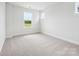Bright bedroom with large window at 10113 Mamillion Dr, Huntersville, NC 28078