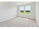 Carpeted bedroom with two windows and natural light at 10113 Mamillion Dr, Huntersville, NC 28078