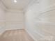Walk-in closet with multiple levels of wire shelving for organization at 10113 Mamillion Dr, Huntersville, NC 28078