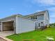 Exterior view of a home, garage, and fenced backyard at 10113 Mamillion Dr, Huntersville, NC 28078