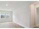 Bright and spacious living room featuring hardwood floors and exterior view at 10113 Mamillion Dr, Huntersville, NC 28078