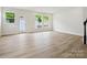 Open living room featuring hardwood floors, recessed lighting, and backyard view at 10113 Mamillion Dr, Huntersville, NC 28078