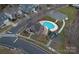 Aerial shot of a community clubhouse, pool and playground near residential homes at 11604 Bradford Park Dr, Davidson, NC 28036