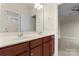 Bathroom featuring double vanity with modern faucets and access to a large bedroom at 11604 Bradford Park Dr, Davidson, NC 28036