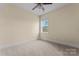 Bedroom with neutral carpet, trim, paint, and a ceiling fan for optimal comfort at 11604 Bradford Park Dr, Davidson, NC 28036