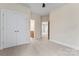 Bedroom with neutral carpet, paint and access to a full bathroom and closet at 11604 Bradford Park Dr, Davidson, NC 28036
