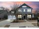 Charming two-story home with a welcoming front porch and a spacious two-car garage at 11604 Bradford Park Dr, Davidson, NC 28036