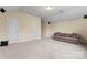 Spacious living room setup, with a couch and ceiling-mounted speakers for surround sound at 11604 Bradford Park Dr, Davidson, NC 28036