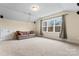 Cozy living room with a comfortable sofa and natural light from a large window at 11604 Bradford Park Dr, Davidson, NC 28036