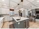 An open kitchen with marble countertops, stainless appliances, kitchen island, and eat in area at 123 Yellow Jacket Cir, Mooresville, NC 28117