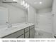 Hallway bathroom with double bowl vanity, white cabinets, and a shower and tub combo at 213 Lake George Dr, Shelby, NC 28152